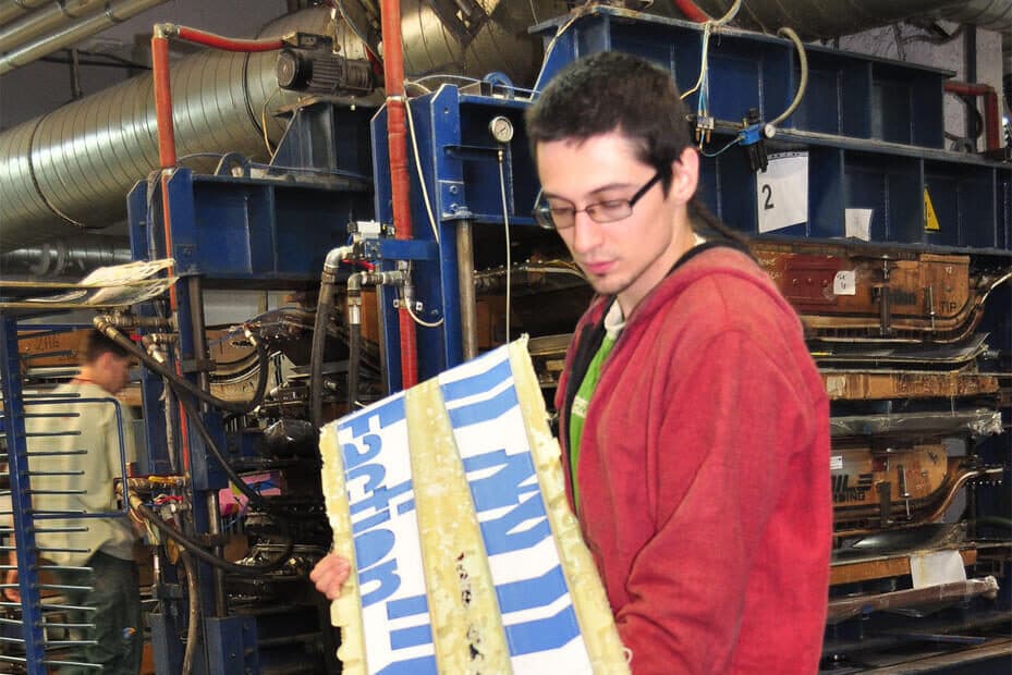 Fresh-pressed skis pulled from the lamination mould
